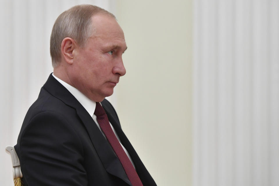 Russian President Vladimir Putin listens to FIFA President Gianni Infantino, during a meeting in the Kremlin in Moscow, Russia, Wednesday, Feb. 20, 2019. (Yuri Kadobnov/Pool Photo via AP)