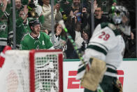 Dallas Stars center Tyler Seguin, leff rear, celebrates after scoring against Minnesota Wild goaltender Marc-Andre Fleury (29) in the first period of Game 2 of an NHL hockey Stanley Cup first-round playoff series, Wednesday, April 19, 2023, in Dallas. (AP Photo/Tony Gutierrez)