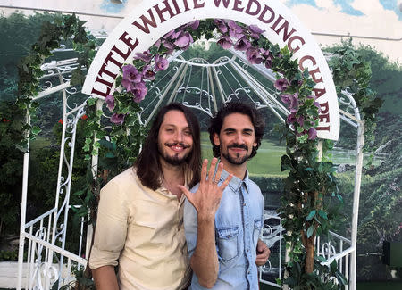 Xavi Carpio and Israel Aznar from Barcelona pose following their wedding at A Little White Wedding Chapel in Las Vegas, Nevada, U.S., October 4, 2017. Photo taken October 4, 2017. REUTERS/Sharon Bernstein