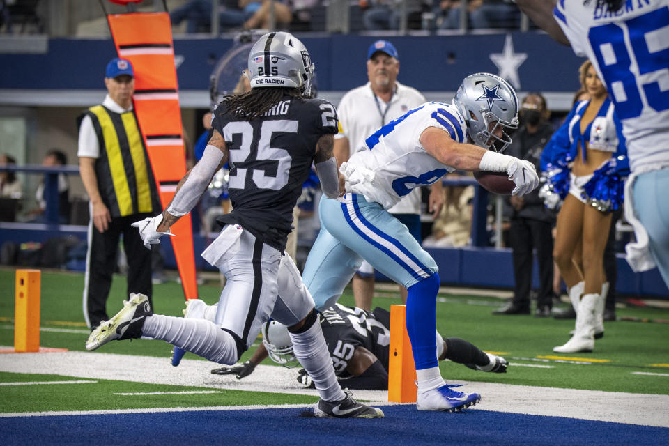 Nov 25, 2021; Arlington, Texas, USA; Dallas Cowboys tight end Sean McKeon (84) scores a touchdown against the Las Vegas Raiders during the first quarter at AT&T Stadium. Mandatory Credit: Jerome Miron-USA TODAY Sports