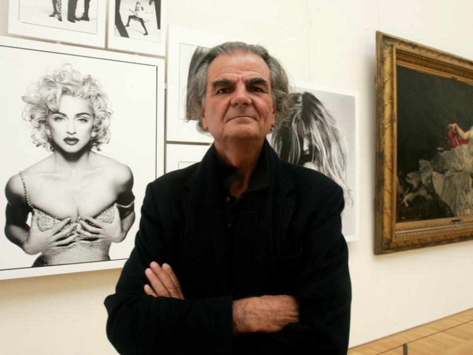 Demarchelier with one of his photographs of Madonna on display at the Petit Palais in Paris (AP)