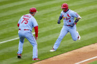 St. Louis Cardinals' Yadier Molina (4) runs past third base coach Ron 'Pop' Warner (75) after hitting a three-run homer during the third inning of a baseball game against the Philadelphia Phillies, Saturday, April 17, 2021, in Philadelphia. (AP Photo/Laurence Kesterson)