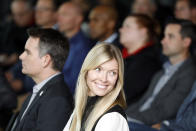 Chandra Johnson smiles during the retirement announcement by her husband, NASCAR driver Jimmie Johnson near Charlotte, N.C., Thursday, Nov. 21, 2019. (AP Photo/Bob Leverone)