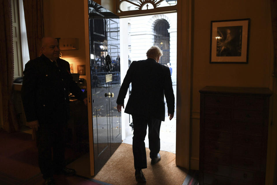 Britain's Prime Minister Boris Johnson leaves 10 Downing Street on route to Buckingham Palace ahead of an audience with Queen Elizabeth II and the formal start of the General Election, in London, Wednesday, Nov. 6, 2019.(Stefan Rousseau/Pool Photo via AP)