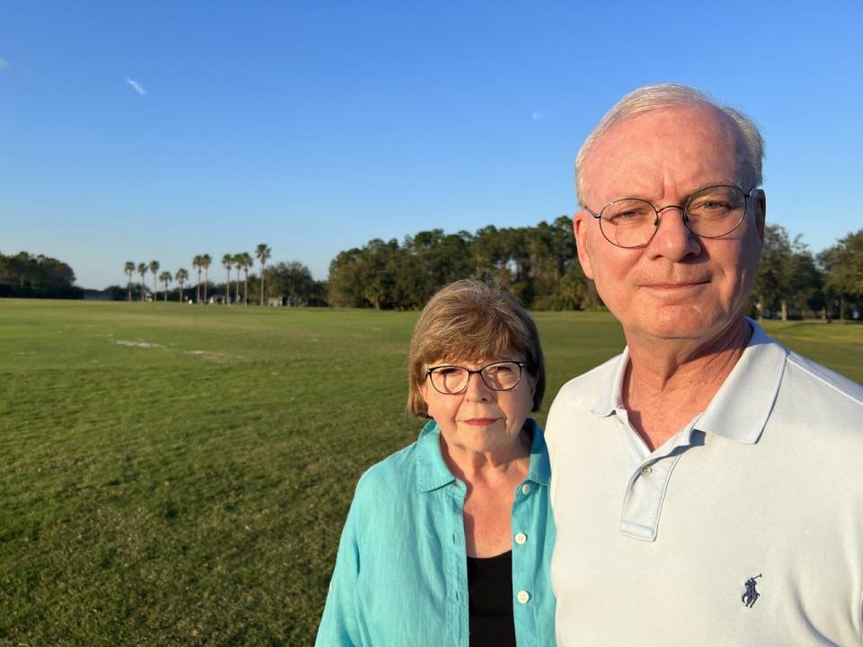 LPGA International residents Mary Jane and Dan Hurst stand on the site of the proposed LPGA Golf Villas development on Friday, Dec. 9, 2022. The development would add 154 homes and 40 townhomes where the Daytona Beach golf community's 3-hole practice course is located.