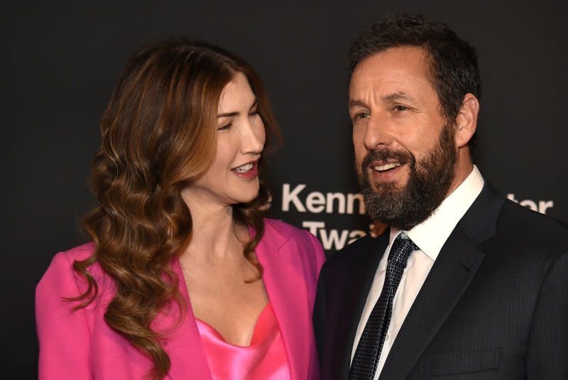 Adam Sandler (R), pictured with Jackie Sandler, stars in the new film "Spaceman." File Photo by Mike Theiler/UPI