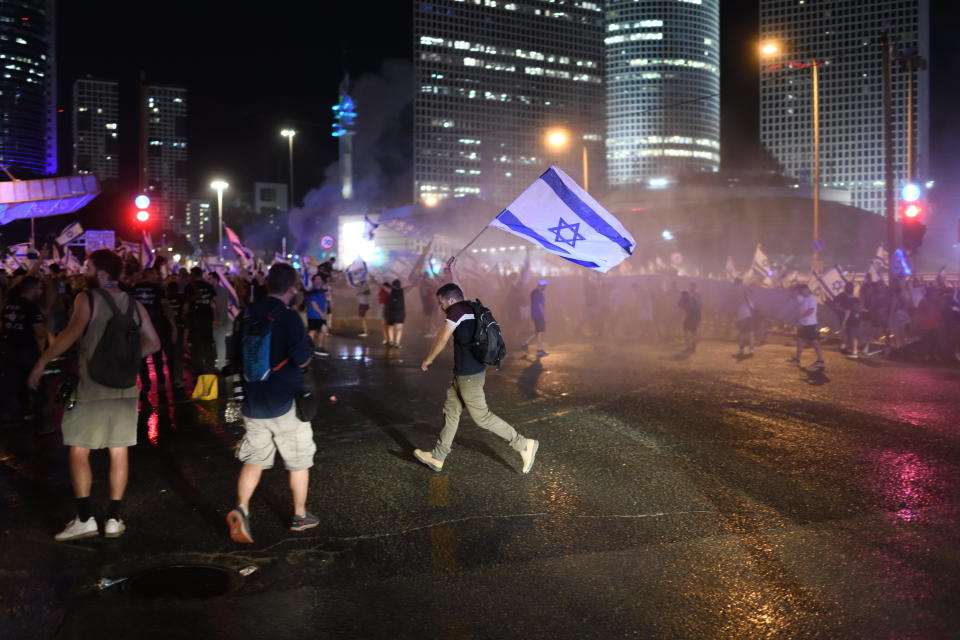 Israeli protesters confront police during a rally against the Israeli goverment's judicial overhaul bills in the coastal city of Tel Aviv, July 24, 2023. / Credit: Gili Yaari/NurPhoto/Getty