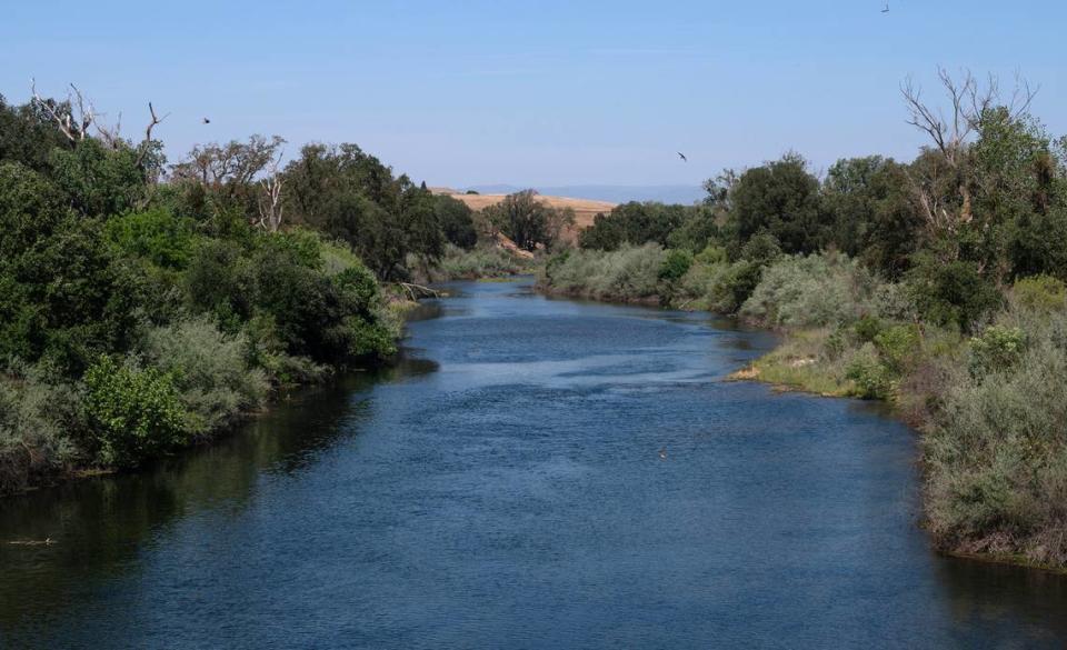 Looking east, the Tuolumne River flows through Roberts Ferry Calif., on Tuesday, May 24, 2022.