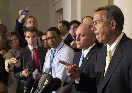 Speaker of the House John Boehner (R-OH) (R) and newly elected House Majority Whip Steve Scalise (R-LA) (2nd R) speak to the media on Capitol Hill in Washington June 19, 2014. REUTERS/Joshua Roberts