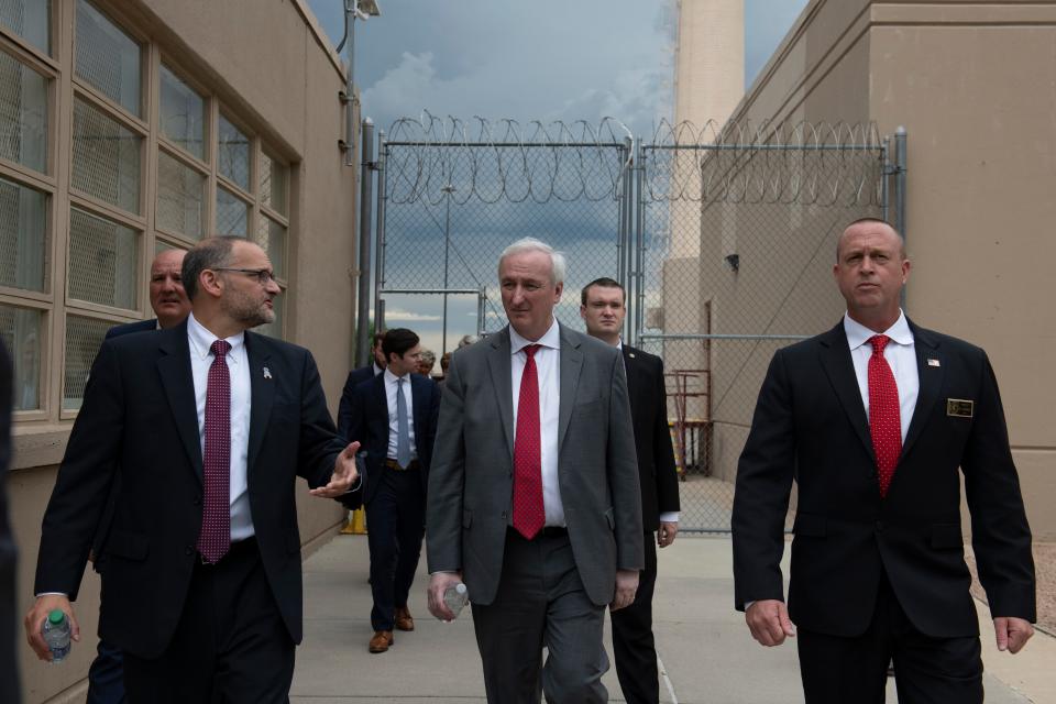 Deputy Attorney General Jeffrey Rosen (center) tours the Englewood Federal Correctional Institution with Hugh Hurwitz (at left), acting director of the Federal Bureau of Prisons. At right is the warden of the facility, Brad Greilick.