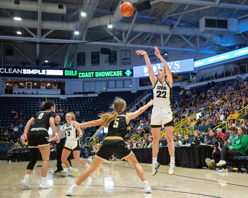 Iowa guard Caitlin Clark (22) began the 2023-24 season with 2,717 career points.