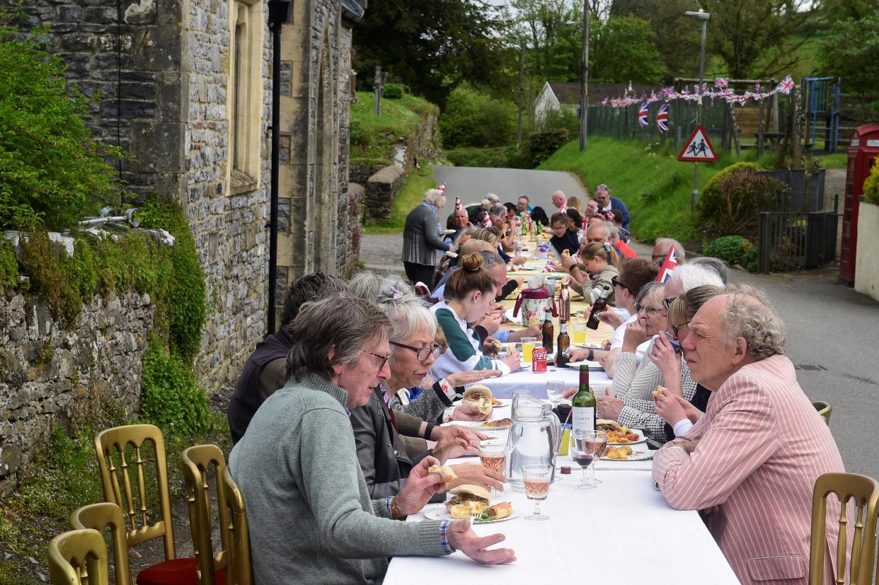 Residents enjoy a coronation street party in the village of Lampeter Velfrey, Wales (REUTERS)
