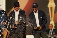 <p>Vice-captains Jim Furyk and vice-captain Tiger Woods of the United States spray champagne after winning the Ryder Cup during the closing ceremony of the 2016 Ryder Cup at Hazeltine National Golf Club on October 2, 2016 in Chaska, Minnesota. (Photo by Streeter Lecka/Getty Images)</p>