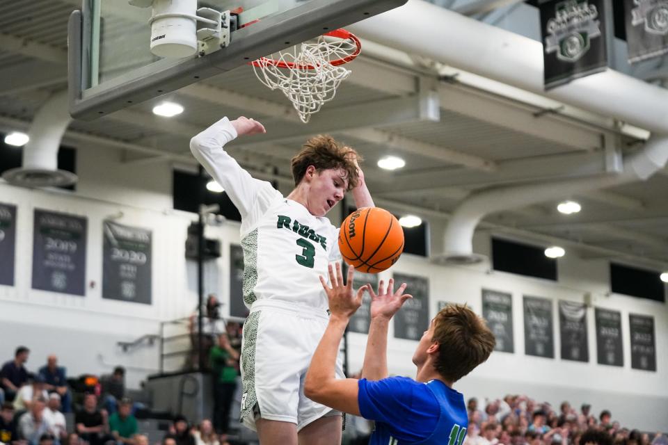 Fossil Ridge's Drew Larson (3) dunks in a second-round high school basketball playoff game against Doherty at Fossil Ridge High School on Feb. 25.