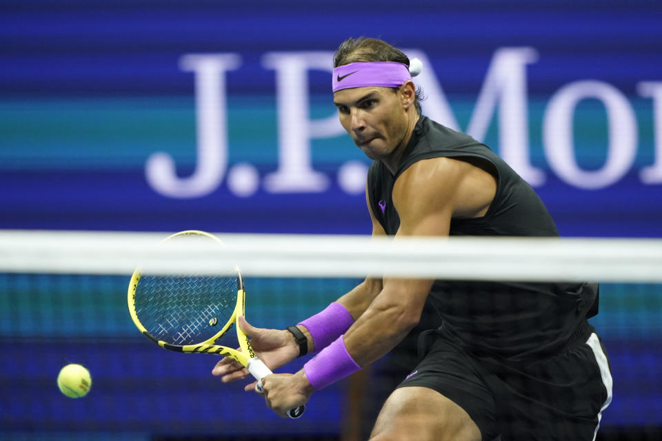 Rafael Nadal, of Spain, returns a shot to Matteo Berrettini, of Italy, during the men's singles semifinals of the U.S. Open tennis championships Friday, Sept. 6, 2019, in New York. (AP Photo/Eduardo Munoz Alvarez)