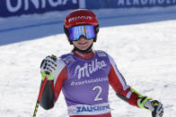 Austria's Ariane Raedler smiles at finish area after completing an alpine ski, women's World Cup super-G race in Zauchensee, Austria, Sunday, Jan. 16, 2022. (AP Photo/Marco Trovati)