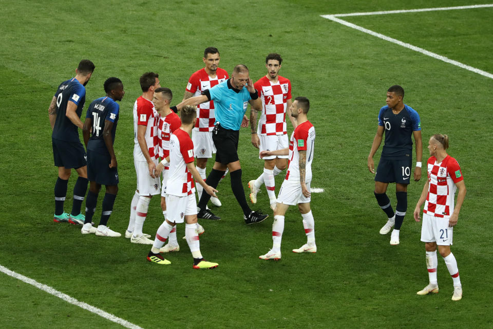 MOSCOW, RUSSIA - JULY 15:  Referee Nestor Pitana holds his hand to his ear before consulting VAR and consequently awarding France a penalty during the 2018 FIFA World Cup Final between France and Croatia at Luzhniki Stadium on July 15, 2018 in Moscow, Russia.  (Photo by Robert Cianflone - FIFA/FIFA via Getty Images)