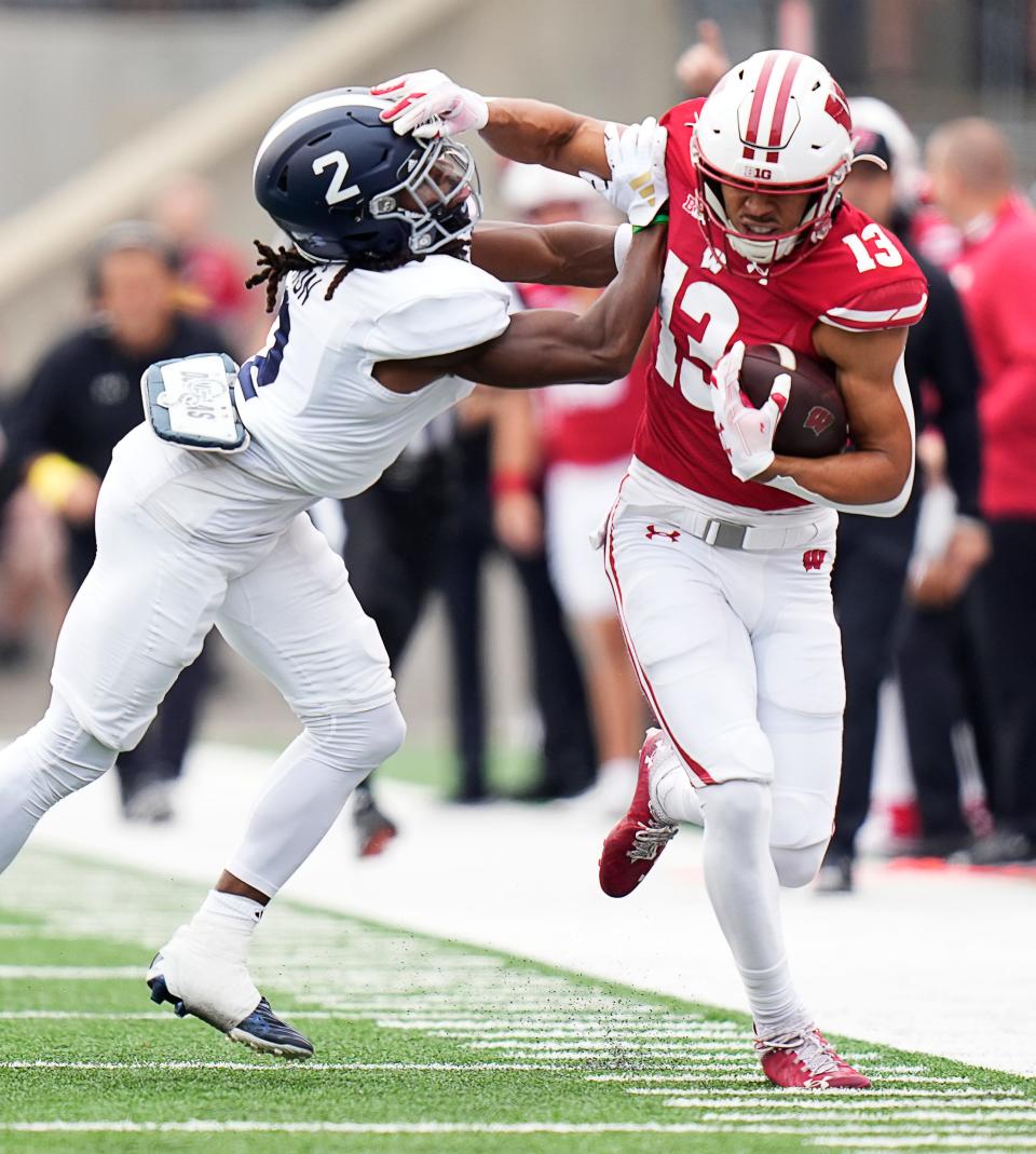 Wisconsin wide receiver Chimere Dike (13) is pushed out of bounds by Georgia Southern defensive back Jalen Denton (2) during the first half of the game on Saturday September 16, 2023 at Camp Randall Stadium in Madison, Wis.