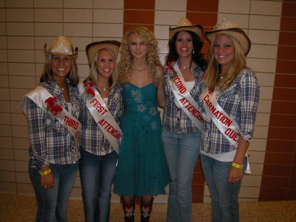 Taylor Swift stands with the 2006 Greater Alliance Carnation Festival queen and her court at Alliance High School after Swift performed as one of the opening acts in a fundraiser concert in 2006. The queen, standing at far right, is Kayla Faudree Heimann. The court members, from left, are 3rd Attendant Jamie Williams; 1st Attendant and Miss Congeniality Jessica Markle; Swift; and 2nd Attendant Angela Rogel.