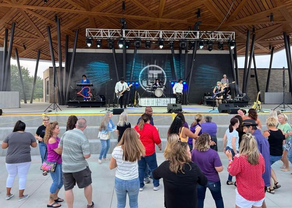 People dance in front of the stage during Saturday's Prince tribute concert at the Jackson Amphitheater. The new venue opened last summer. More improvements are planned for the site.