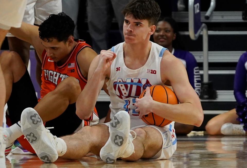 Jan 4, 2023; Evanston, Illinois, USA; Northwestern Wildcats guard Brooks Barnhizer (13) reacts after recovering a loose ball against the Illinois Fighting Illini during the second half at Welsh-Ryan Arena. Mandatory Credit: David Banks-USA TODAY Sports