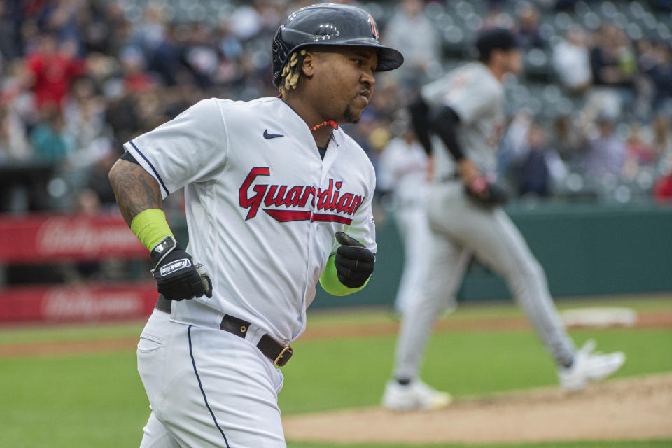 Cleveland Guardians' Jose Ramirez, foreground, rounds the bases after a solo home run off Detroit Tigers starting pitcher Joey Wentz, back right, during the fourth inning of a baseball game in Cleveland, Monday, May 8, 2023. (AP Photo/Phil Long)