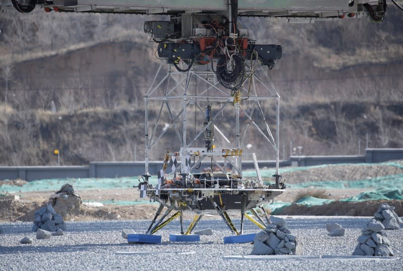 A lander for China's Mars mission is seen before a hovering-and-obstacle avoidance test at a test facility in Huailai