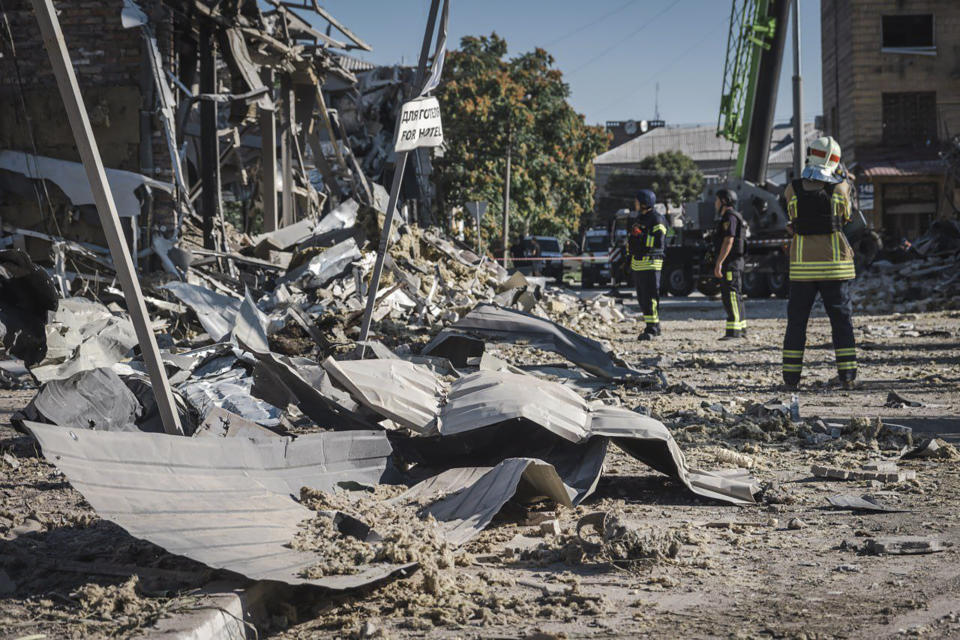 In this photo provided by the Ukrainian Emergency Service, rescuers work on the scene of a building damaged after Russian missile strikes in Pokrovsk, Donetsk region, Ukraine, Tuesday, Aug. 8, 2023. (Ukrainian Emergency Service via AP Photo)