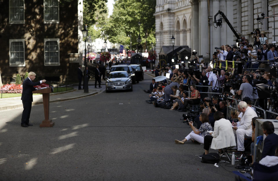 Britain's new Prime Minister Boris Johnson speaks outside 10 Downing Street, London, Wednesday, July 24, 2019. Boris Johnson has replaced Theresa May as Prime Minister, following her resignation last month after Parliament repeatedly rejected the Brexit withdrawal agreement she struck with the European Union. (AP Photo/Matt Dunham)