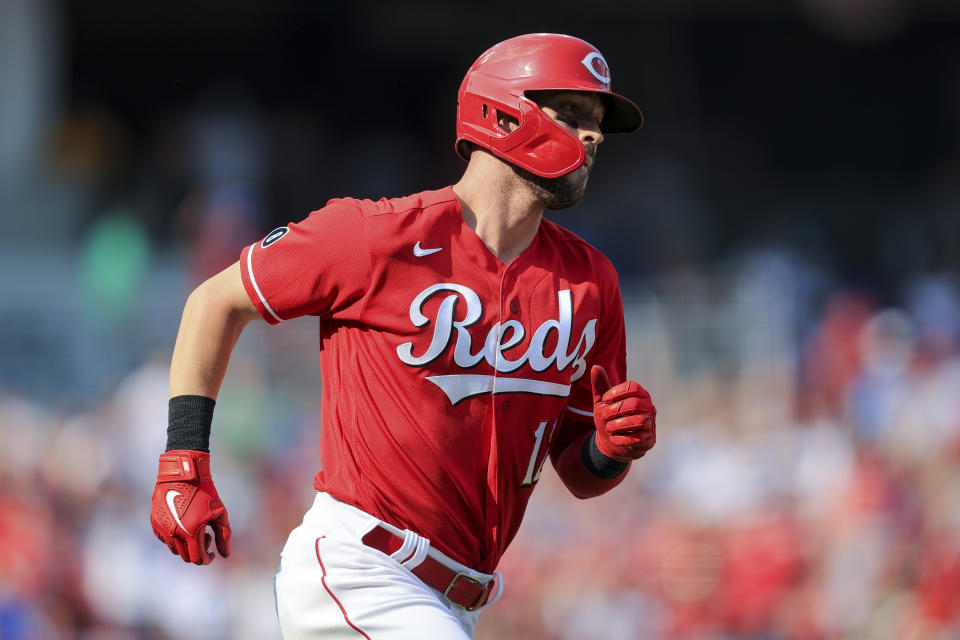 Cincinnati Reds' Tyler Naquin runs the bases after hitting a solo home run during the fifth inning of a baseball game against the Chicago Cubs in Cincinnati, Saturday, July 3, 2021. (AP Photo/Aaron Doster)