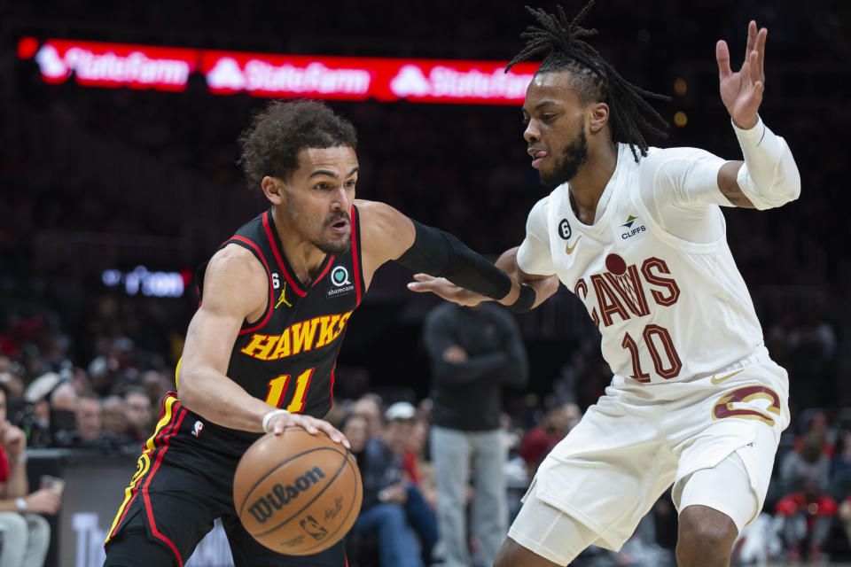 Atlanta Hawks guard Trae Young drives against Cleveland Cavaliers guard Darius Garland during the first half of an NBA basketball game Tuesday, March 28, 2023, in Atlanta. (AP Photo/Hakim Wright Sr.)