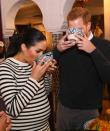 <p>Prince Harry and Meghan Markle attend a cooking demonstration where under-privileged children learn traditional Moroccan recipes from famous chefs. The couple sample the day's cuisine by drinking from bowls. </p>