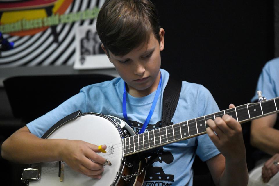 Twelve-year-old Abram Murphy plays the banjo during Camp Bluegrass on Wednesday, July 20 at South Plains College in Levelland. Murphy is part of his family's bluegrass band in Amarillo.