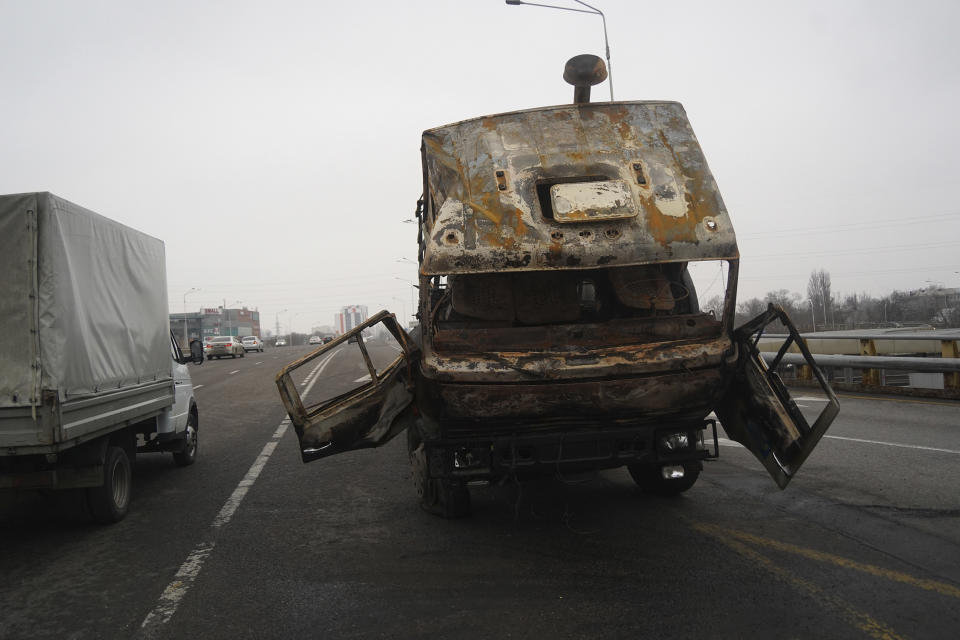 A military truck, which was burned during clashes, is seen on a street in Almaty, Kazakhstan, Sunday, Jan. 9, 2022. Kazakhstan's health ministry says 164 people have been killed in protests that have rocked the country over the past week. President Kassym-Jomart Tokayev's office said Sunday that order has stabilized in the country and that authorities have regained control of administrative buildings that were occupied by protesters, some of which were set on fire. (Vladimir Tretyakov/NUR.KZ via AP)