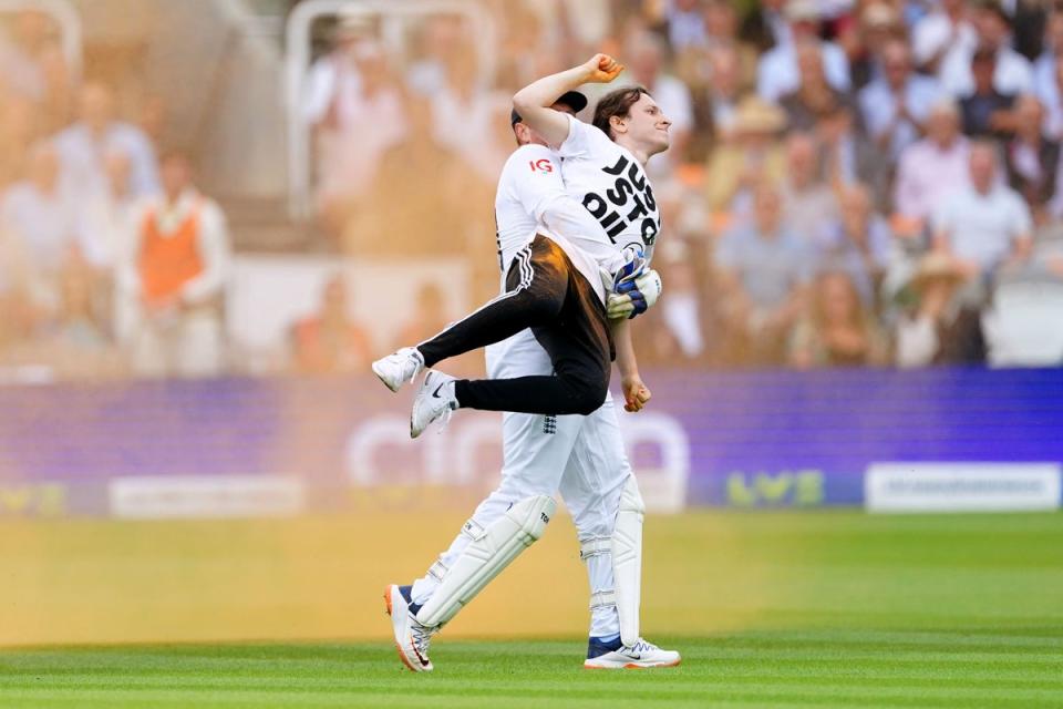 England’s Jonny Bairstow carries a Just Stop Oil protester off the pitch at Lord’s (Mike Egerton/PA). (PA Wire)