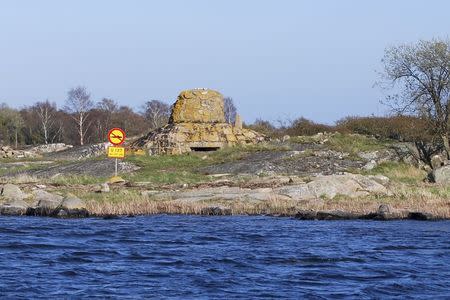 A mock road-traffic sign prohibiting submarines is seen April 29, 2015, marking the site where a Russian Whiskey-class submarine ran aground near the Swedish naval port of Karlskrona in 1981. REUTERS/Tim Hepher