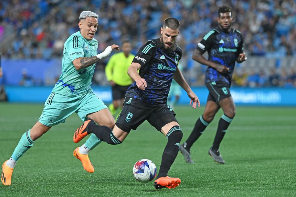 Apr 22, 2023; Charlotte, North Carolina, USA; Charlotte FC attacker Enzo Copetti (9) pursues Columbus Crew defender Milos Degenek (5) in the first half at Bank of America Stadium. Mandatory Credit: Griffin Zetterberg-USA TODAY Sports