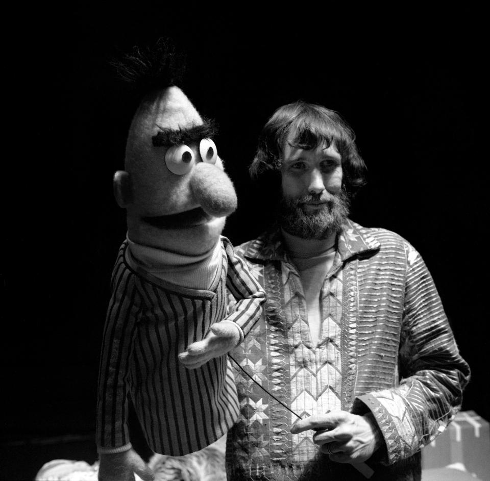 Puppeteer Jim Henson holds Bert during rehearsals for an episode of <em>Sesame Street</em> at Reeves TeleTape Studio in 1970 in N.Y.C.