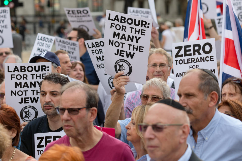 The campaign group, Campaign Against Antisemitism, Jewish community groups and their supporters stage a protest in Parliament Square, London, England on July 19, 2018 against the Labour Party anti-semitism code following the partys announcement that it will take action against Dame Margaret Hodge MP for calling Jeremy Corbyn an antisemite. (photo by Vickie Flores/In Pictures via Getty Images Images)