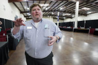 Adam Todd, director of the Governor's Job Fair Network, speaks about the state's efforts to attract applicants to attend the Lee County Area Job Fair in Tupelo, Miss., Tuesday, Oct. 12, 2021. Employers representing a variety of manufacturing, production, service industry, medical and clerical companies attended the day long affair with an eye towards recruitment, hiring, training and retention. (AP Photo/Rogelio V. Solis)