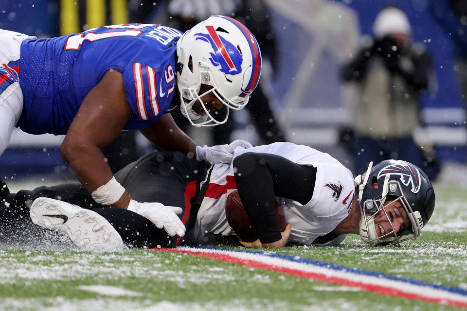 ORCHARD PARK, NEW YORK – JANUARY 02: Matt Ryan #2 of the Atlanta Falcons is sacked by Ed Oliver #91 of the Buffalo Bills in the fourth quarter of the game at Highmark Stadium on January 02, 2022 in Orchard Park, New York. (Photo by Timothy T Ludwig/Getty Images)