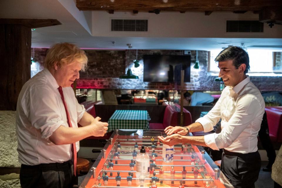 <p>Mr Sunak and Mr Johnson in a Pizza Pilgrims restaurant in London</p>REUTERS