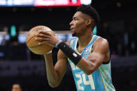 Charlotte Hornets forward Brandon Miller looks to shoot against the Oklahoma City Thunder during the first half of an NBA basketball game in Charlotte, N.C., Sunday, April 7, 2024. (AP Photo/Nell Redmond)