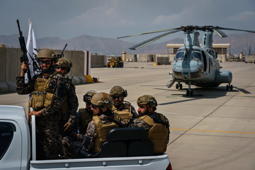 KABUL, AFGHANISTAN -- AUGUST 31, 2021: Taliban fighters take control and secure the Hamid Karzai International Airport, along with all the equipment and weapons left behind after the full U.S. military withdrawal from the country, in Kabul, Afghanistan, Tuesday, Aug. 31, 2021. (MARCUS YAM / LOS ANGELES TIMES)