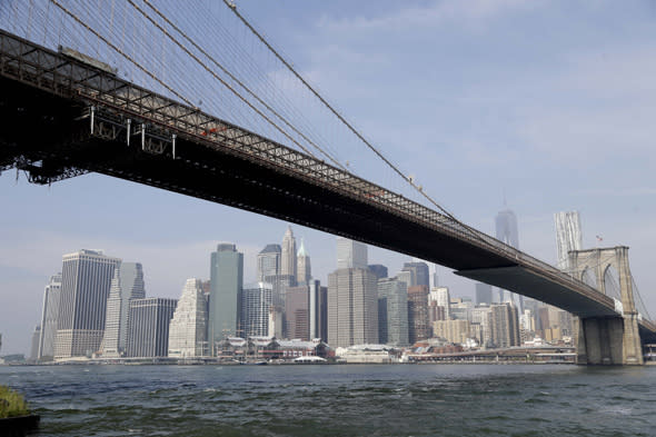 The Brooklyn Bridge stretches in front of the Manhattan skyline in New York, Thursday, Sept. 12, 2013. (AP Photo/Seth Wenig)