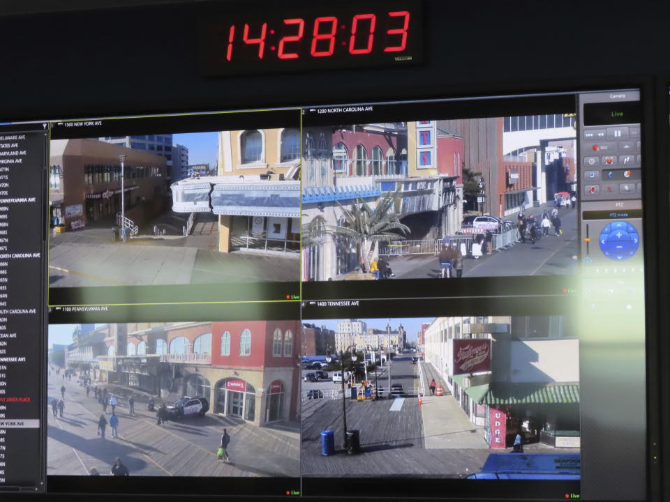 Video screens inside the surveillance center of the Atlantic City, N.J., police department show street scenes being live-streamed from locations around the city on Nov. 16, 2023. The city plans to add hundreds of additional security cameras to the 3,000 that already keep an electronic eye on the seaside gambling resort. (AP Photo/Wayne Parry)