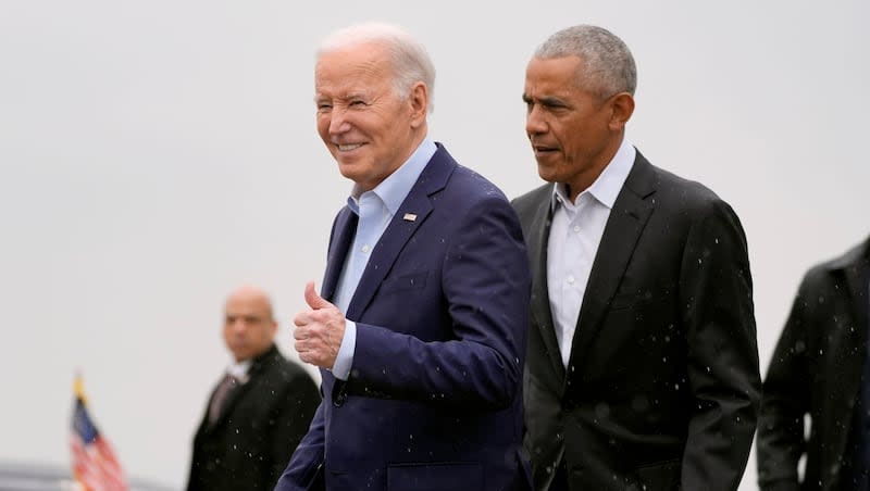 President Joe Biden, left, and former President Barack Obama arrive on Air Force One at John F. Kennedy International Airport, Thursday, March 28, 2024, in New York.