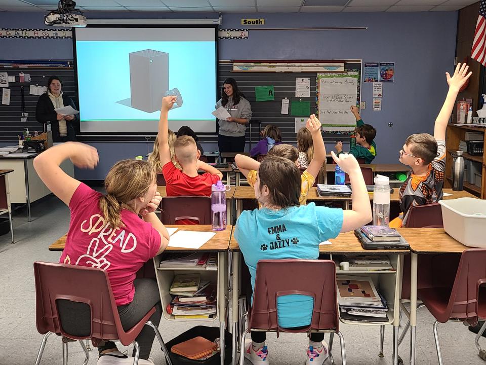 Students from Greencastle High School teach a course on financial literacy to a fifth grade class at Tzouanakis Elementary School in Greencastle, IN as part of their work with the nonprofit "Students Teaching Finance,"  on Nov. 18, 2022.