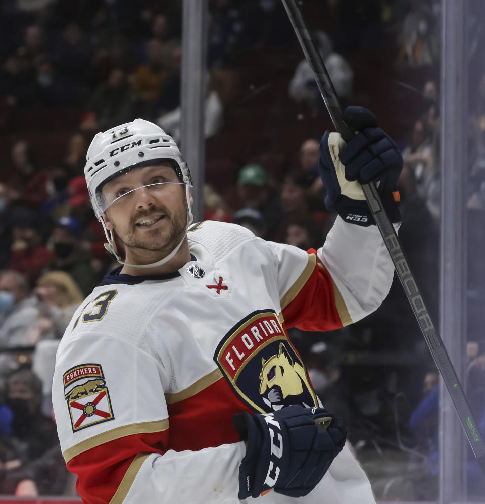 Florida Panthers' Sam Reinhart celebrates his goal against the Vancouver Canucks during the third period of an NHL hockey game Friday, Jan. 21, 2022, in Vancouver, British Columbia. (Darryl Dyck/The Canadian Press via AP)