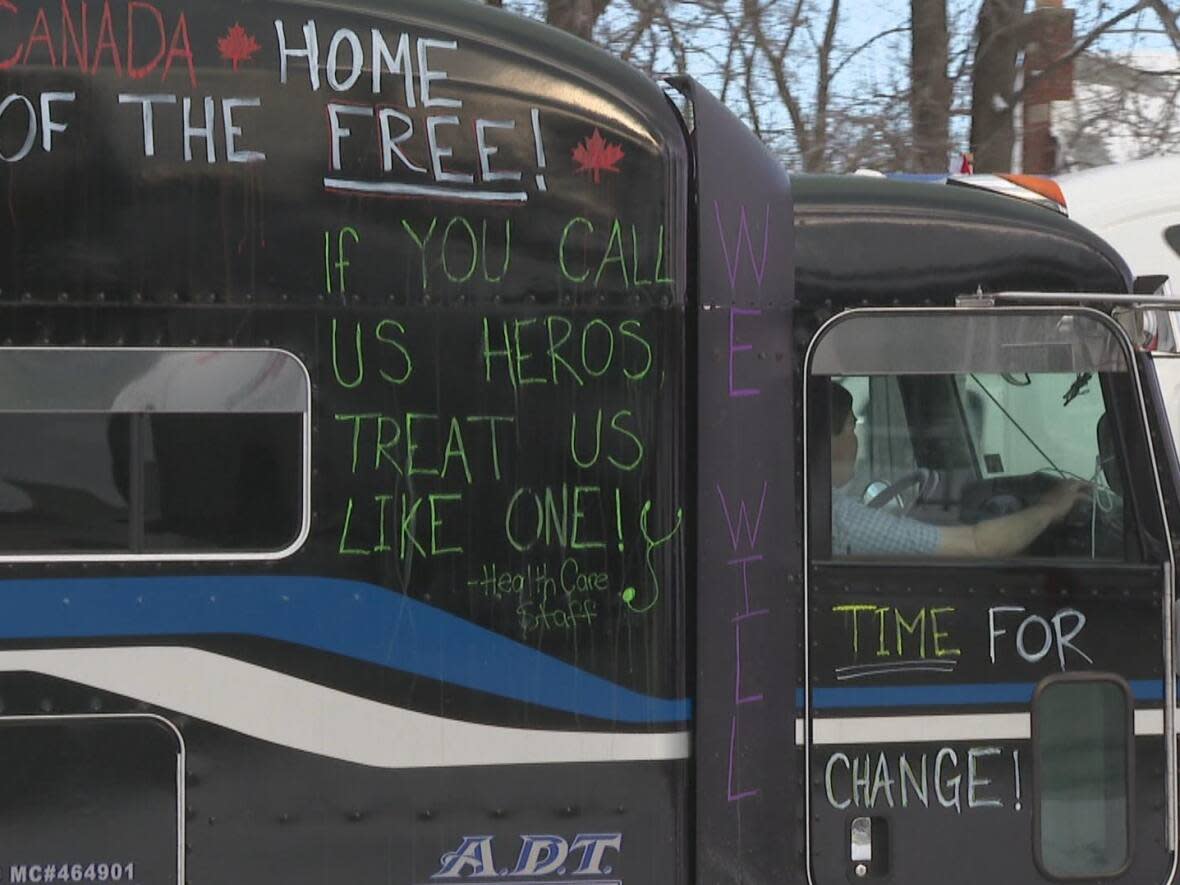 A truck convoy passed through Windsor, Ont. on Sunday. Some drivers are protesting the COVID-19 vaccine mandate for truckers that cross the Canada-United States border. (Jacob Barker/CBC - image credit)